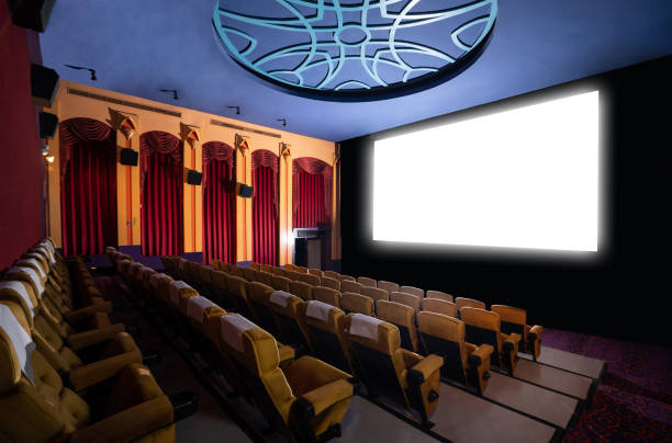 istock Cinema theater showing empty white movie screen. 1211508203