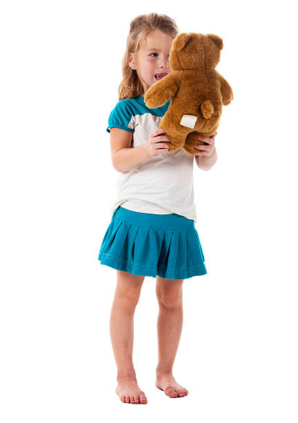 istock Cute blond girl talking to her teddy bear 121150855