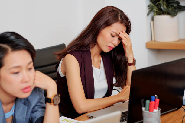 istock Depressed desperate businesswoman 1211509519