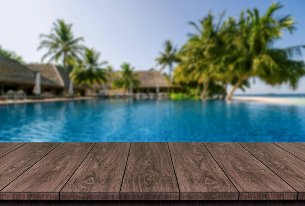 istock Wood table in summer resort holiday vacation. 1211510822