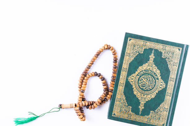 istock Flat lay composition of Qoran and Tasbih 1211513374