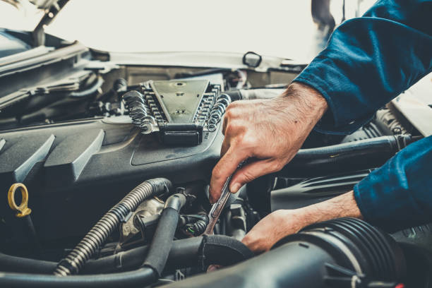 istock Professional mechanic providing car repair service 1211513440