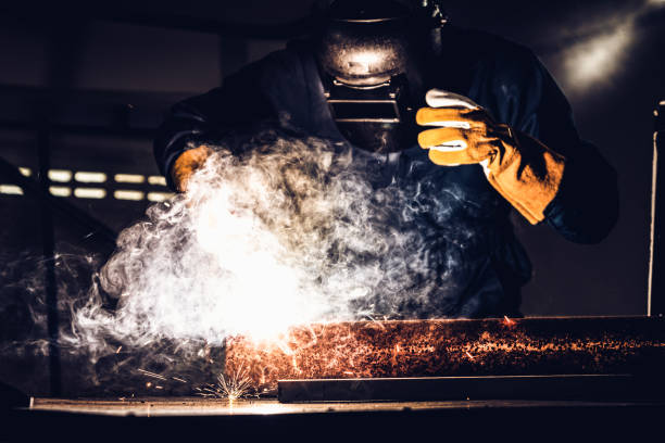 istock Metal welder working with arc welding machine. 1211513493