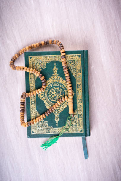 istock Flat lay composition of Qoran and Tasbih 1211513552