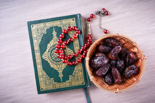 istock Flat lay composition of Qoran and Tasbih 1211513765