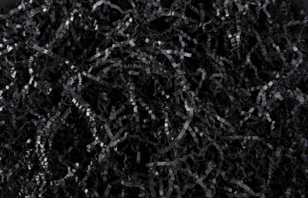 Black color shredded paper - gift box filler background. Black color shredded paper - gift box filler background. shredded photos stock pictures, royalty-free photos & images