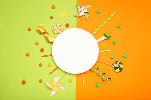 istock Colorful flat lay composition with various party items and candies on paper background 1211519256