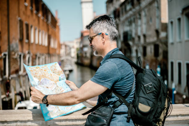 istock Tourist man with map in Venice-Italy 1211524208