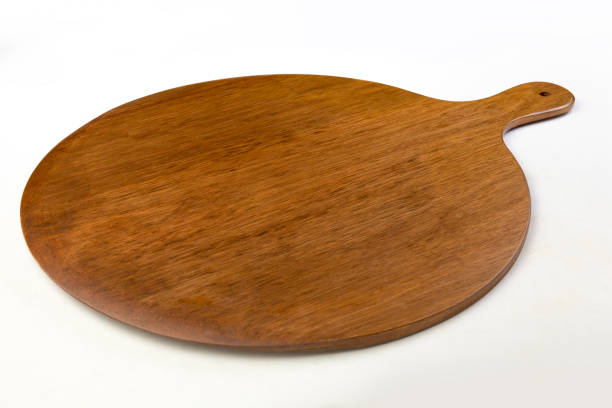 istock Wooden cutting board isolated on a white background 1211524224
