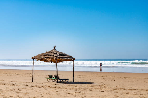 Sunshade at Taghazout, Morocco. Often used to shade the camels and ponies on the beach, this is shown against a clear blue sky.