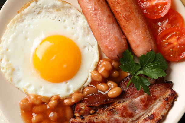 istock Delicious breakfast or lunch with fried eggs on whole background, close up 1211525809