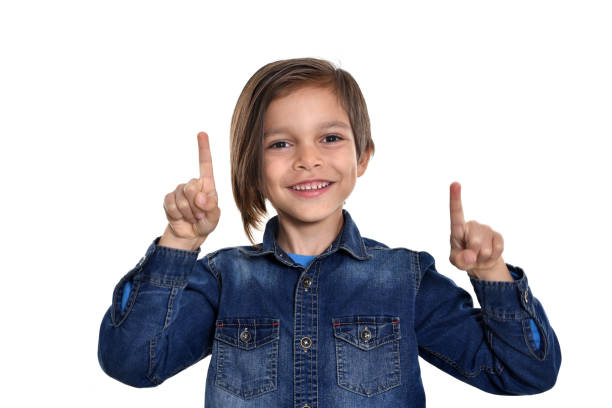 istock smiling little boy on white background 1211528447
