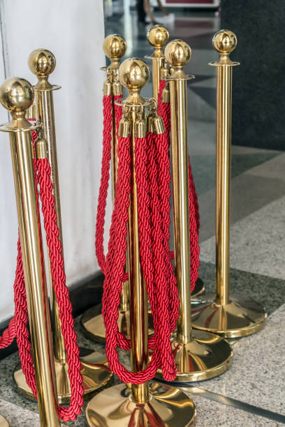 istock Barrier Posts red Rope Stanchion Gates 1211529852