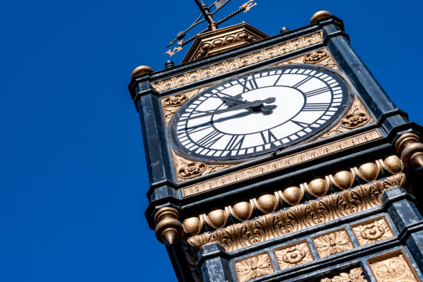 istock Vintage blue and gold ornately decorated clock tower 1211530547