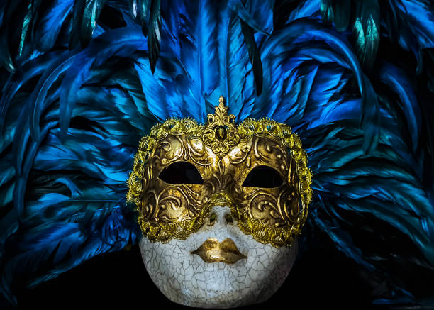 Carnival of Venice Italy coronavirus quarantine COVID-2019 on a blue flu futuristic background. Venetian festival is world-famous for its elaborate face masks.