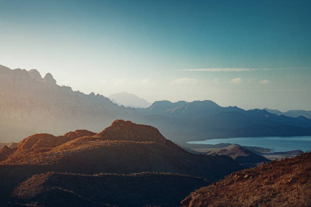 Sun rising over mountains and a bay near Loreto, Mexico