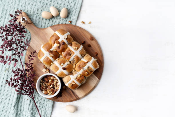 istock Easter hot cross buns on a serving board. 1211534317