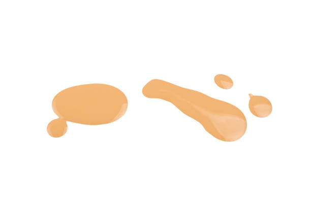 istock Liquid foundation swatch isolated on white background. Close Up of makeup cream sample. 1211534814