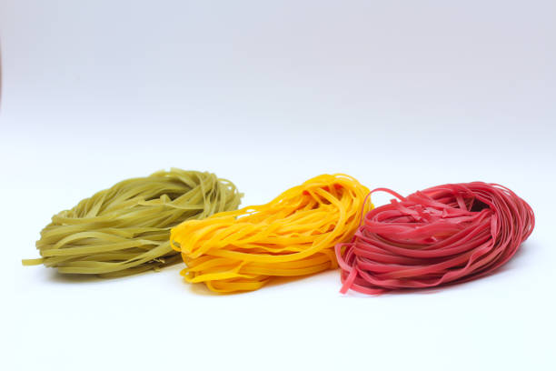 istock Isolated colored spaghetti nests on a white background 1211537292