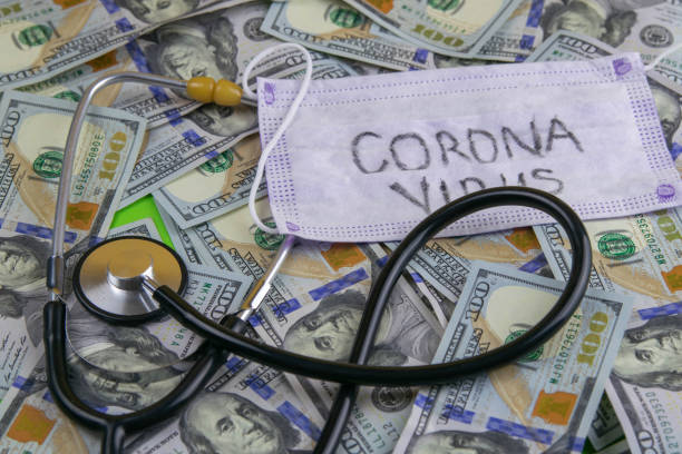 istock covid-19. American banknote phonendoscope, sanitary surcharge concept 1211538056