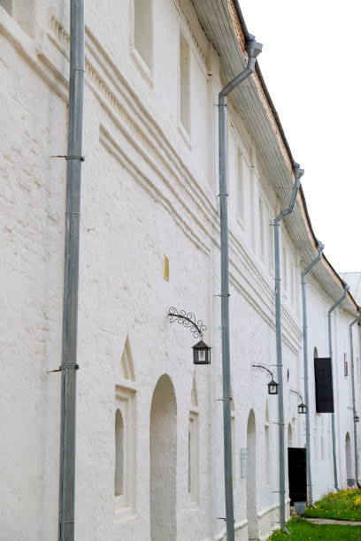 istock White wall of stone building and lantern 1211539919
