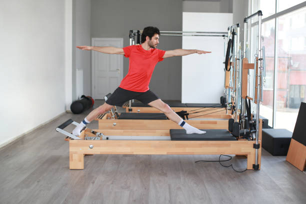 istock Pilates exercise on the reformer machine 1211540349