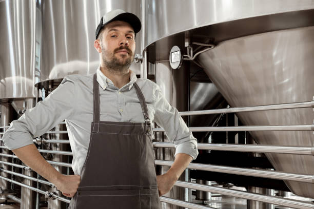 istock Professional brewer on his own craft alcohol production 1211540511