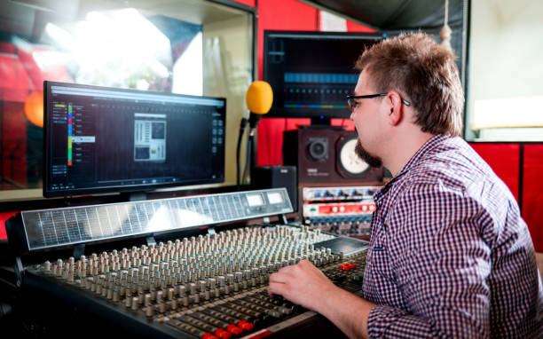 istock Sound producer working at recording studio using soundboard and monitors 1211541166