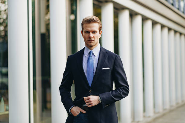 istock Modern businessman near modern office building 1211542586