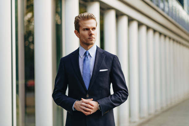 istock Modern businessman near modern office building 1211542604