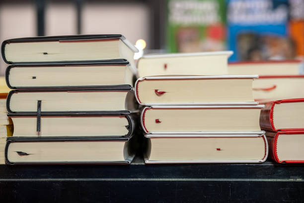 istock Book stack displayed in the book fair for business and education background 1211544318