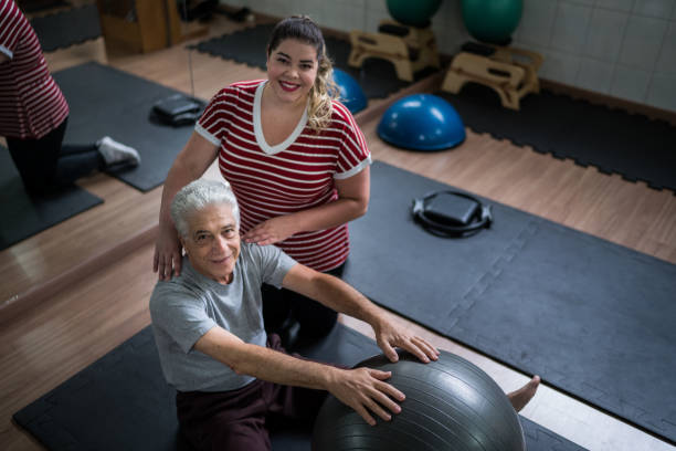 istock Portrait of Senior Man Doing Physical Therapy With Ball 1211547207