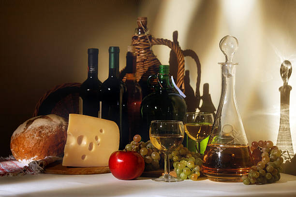 istock wine, cheese, bread, fruits in window light 121154772