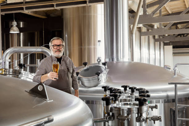 istock Professional brewer on his own craft alcohol production 1211548778