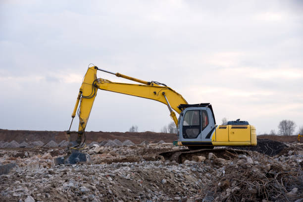 istock Excavator with crusher bucket for crushing concrete 1211551804