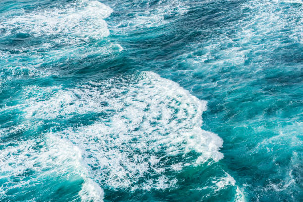 istock Big ocean waves hitting a coral rif. View from above. 1211552446