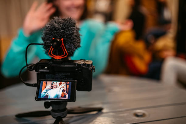 istock Woman vlogging from her hostel room 1211553364