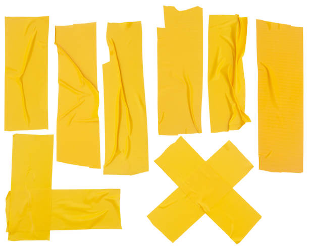 Collection of yellow adhesive tapes isolated Collection of yellow adhesive tapes isolated on white background mustard yellow fabric stock pictures, royalty-free photos & images