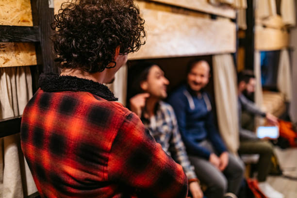 istock Friends talking in hostel room 1211554147