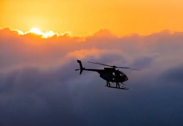 Hawaiian helicopter flying toward Killauea crater