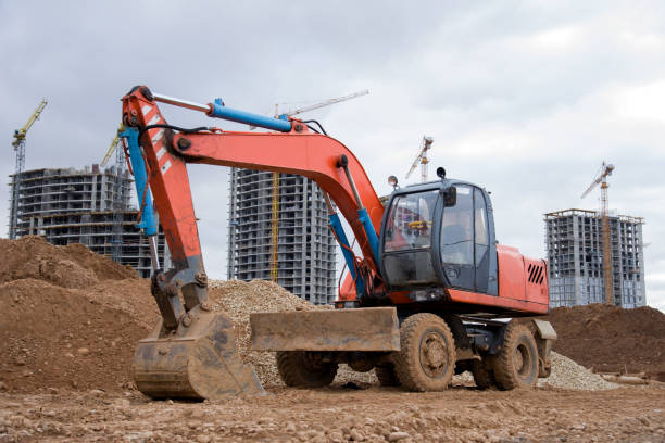 istock Bucked wheel excavator digs ground at a construction site 1211554370