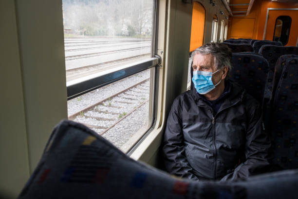 istock Senior man traveling with face mask 1211555478