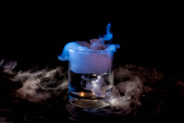 istock Glass with smoke at dark background 1211555612