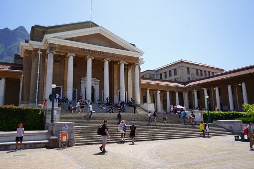 6 February 2020 - University of Cape Town, South Africa:  Students sit on the steps of the University of Cape Town, South Africa