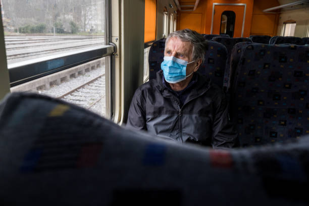 istock Senior man traveling with face mask 1211555842