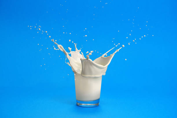 istock Milk splashing out of glass 1211556729