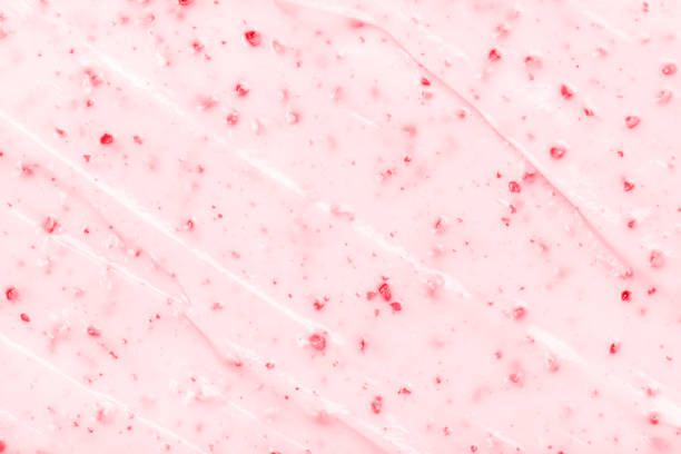Strawberry ice cream texture close up. Top view. Strawberry ice cream texture close up. Top view. Pink fruit ice cream background with small pieces of berries cherry photos stock pictures, royalty-free photos & images