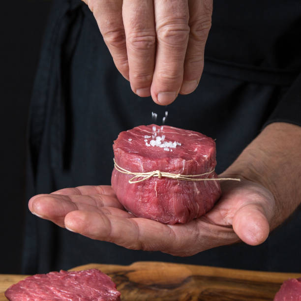 istock Salting Tenderloin Steak 1211558630