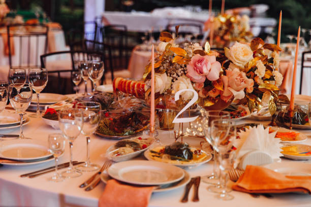 istock tables in outdoor tent evening. Wedding decor. 1211560553