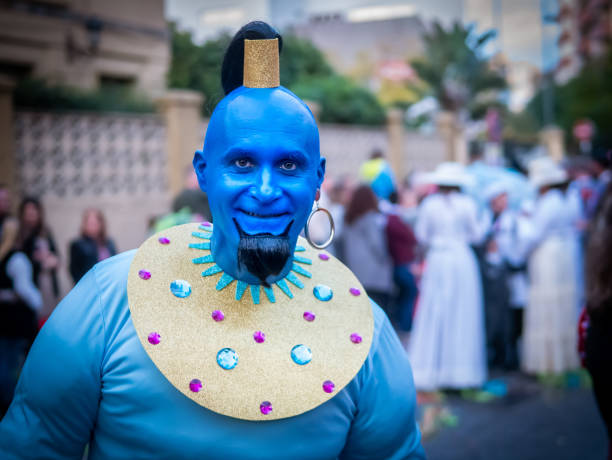 Algeciras, Spain - February 28, 2020: Carnival participants celebrating in the street in Algeciras, Cadiz, Andalusia. Man disguised as Dschinni